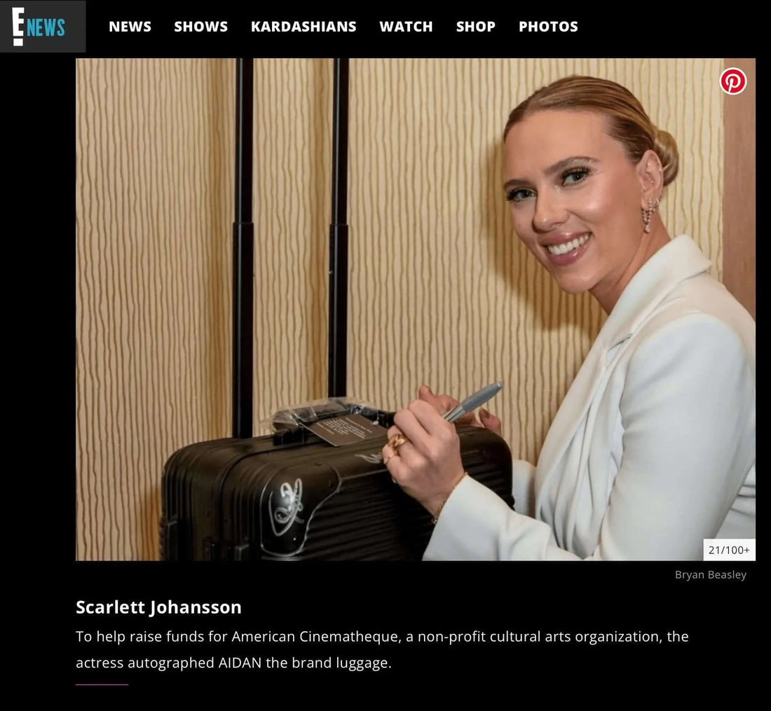 Scarlett Johansson signing the AIDAN Signature Series Case at American Cinematheque Gala event.